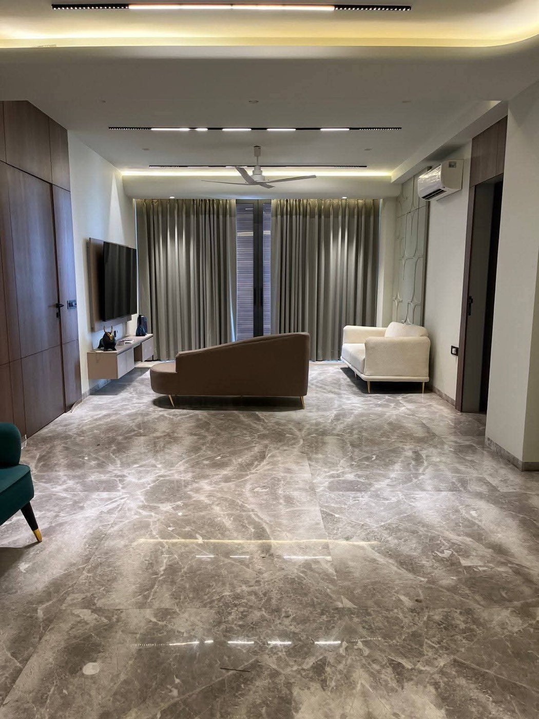 Living room of a fully furnished 4 BHK on rent in Sector 56, Gurugram